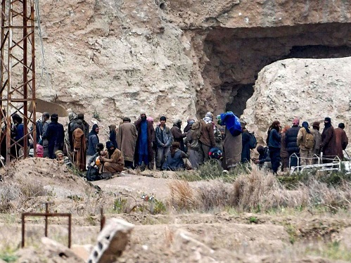 ISIS terrorists, emerge from tunnels, surrender, fall of "caliphate"
